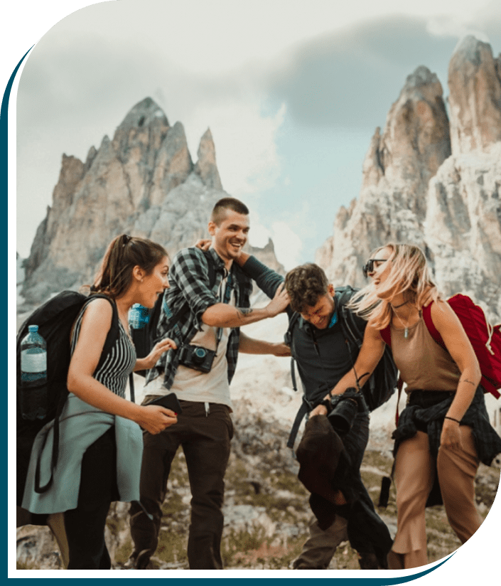 A group of people standing on top of a mountain.